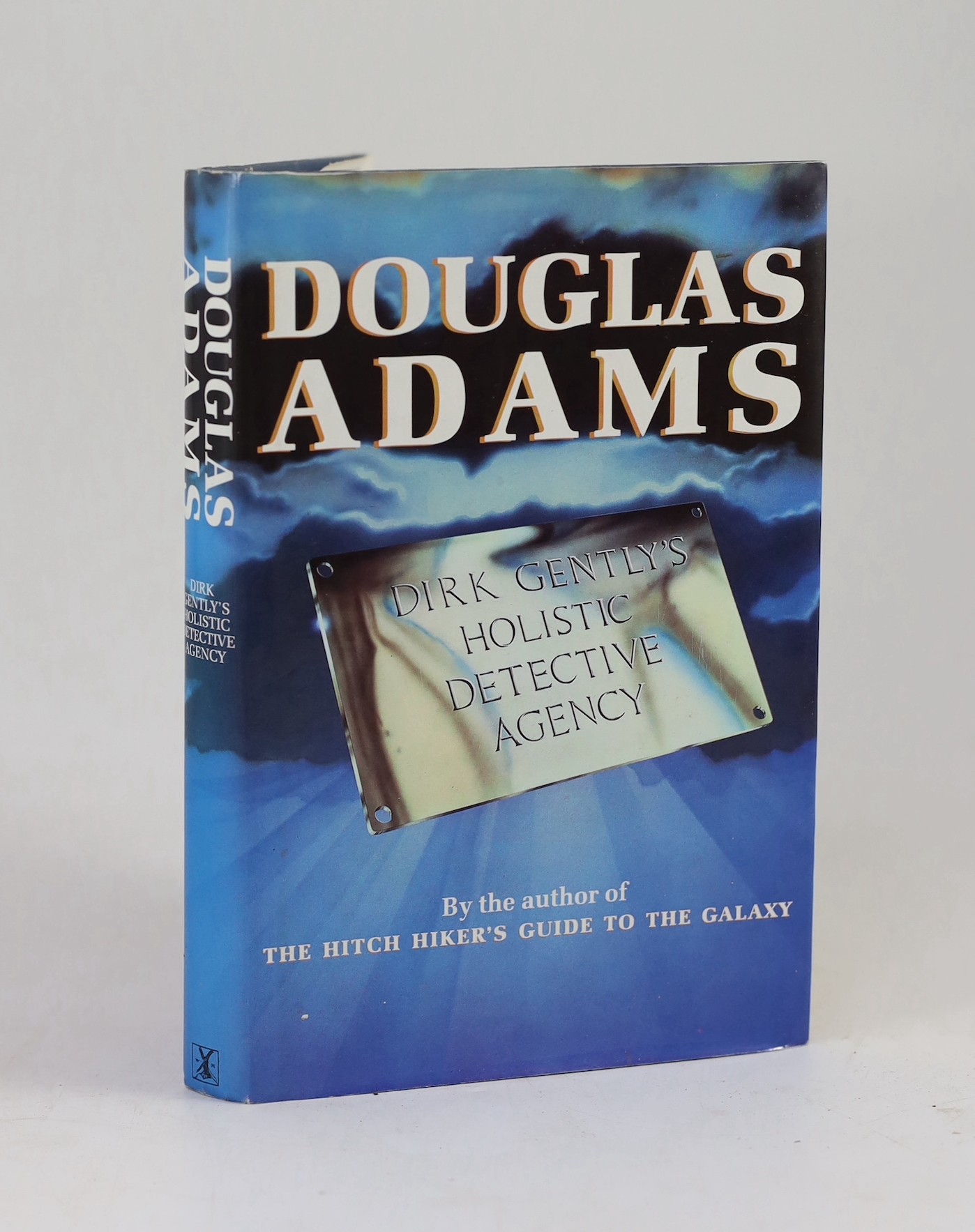 Adams, Douglas - Dirk Gentley’s Holistic Detective Agency, 1st edition, signed by the author, 8vo, original cloth with unclipped d/j, mild toning to outer text block, Heinemann, London, 1987